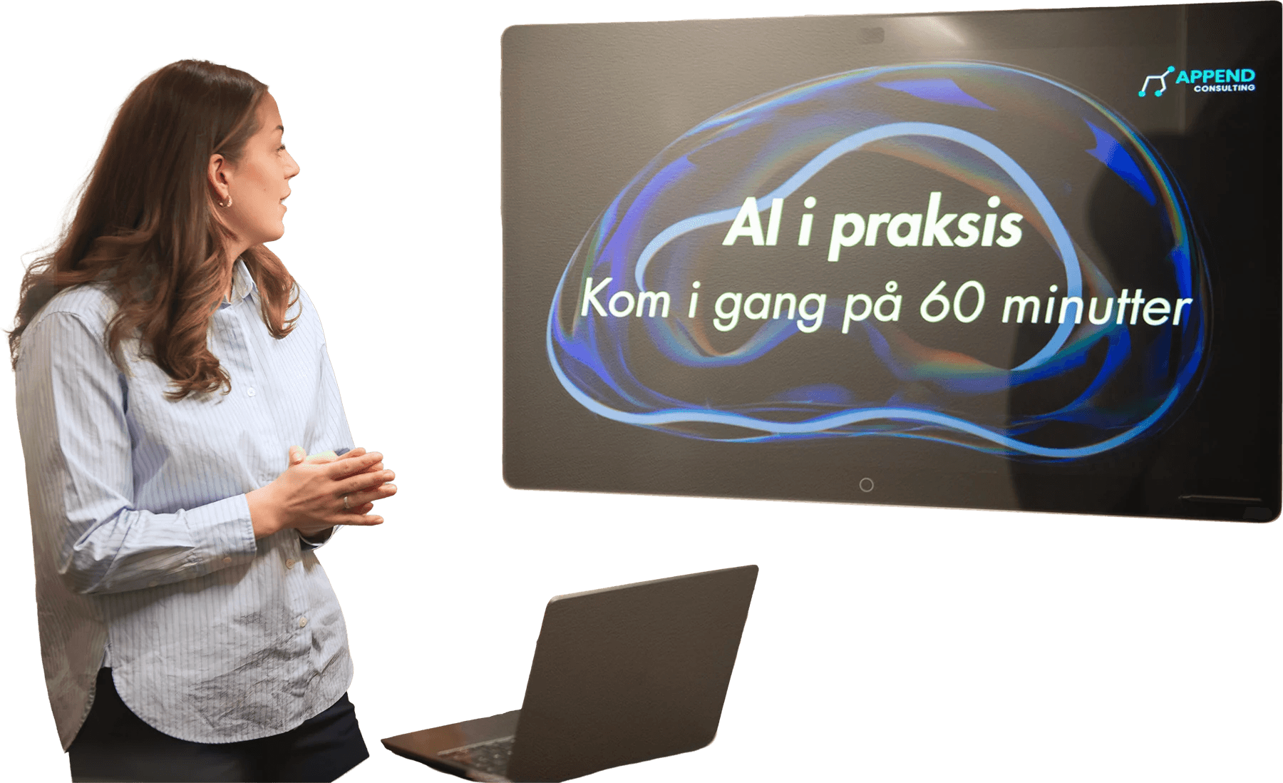 En av Appends konsulenter holder AI-kurs foran en skjerm med «AI i praksis»